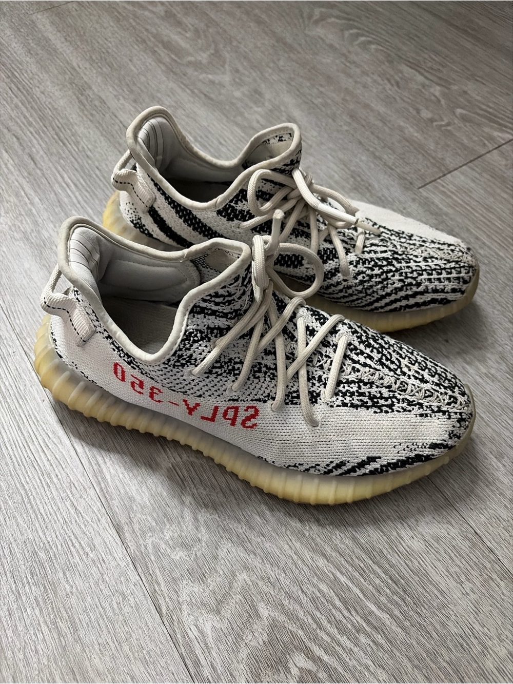 Yeezy 350 White and Black Zebra Knit Sneakers with Cream Sole